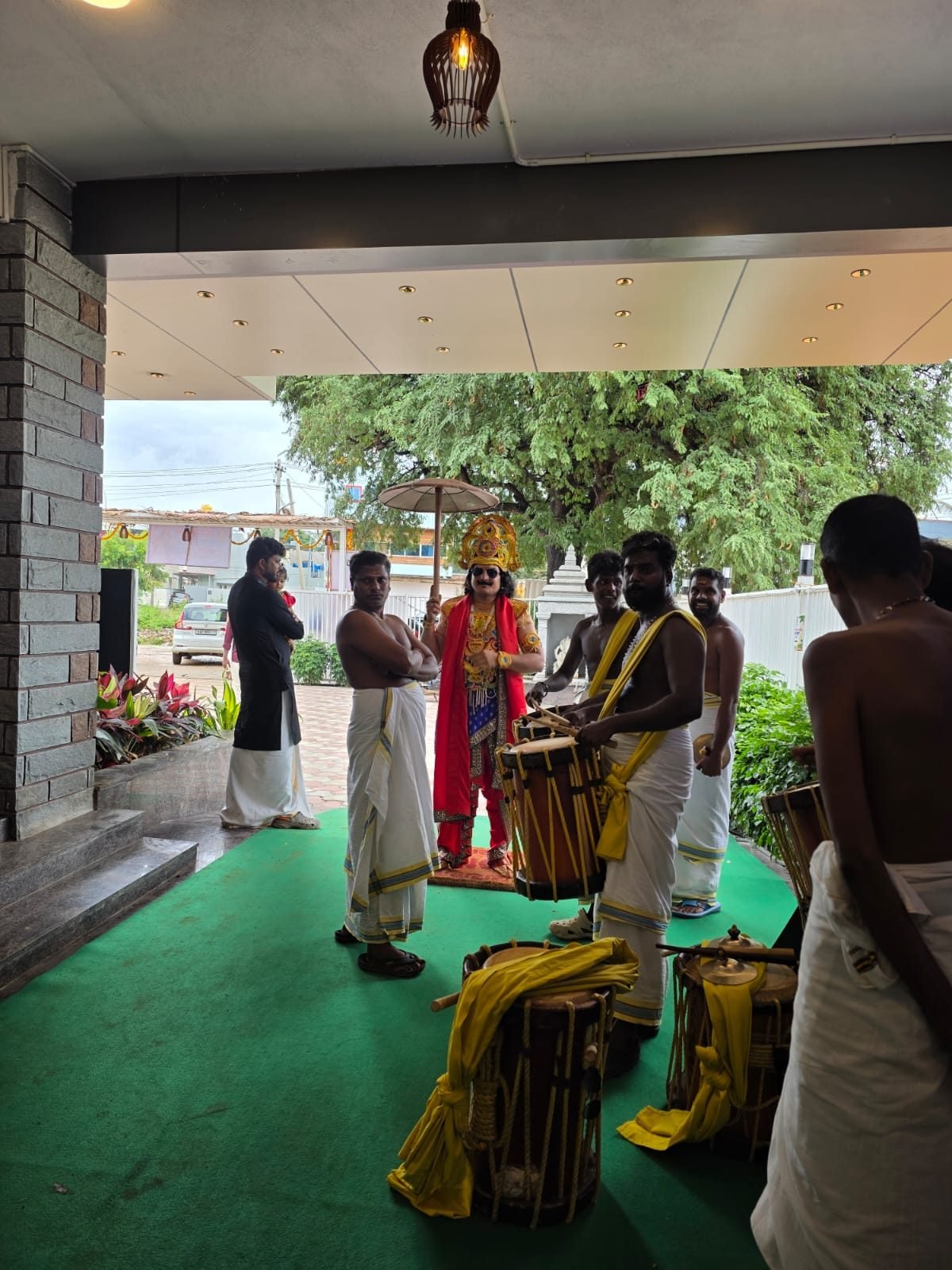 Mahabali character with chenda drummers at the entrance
