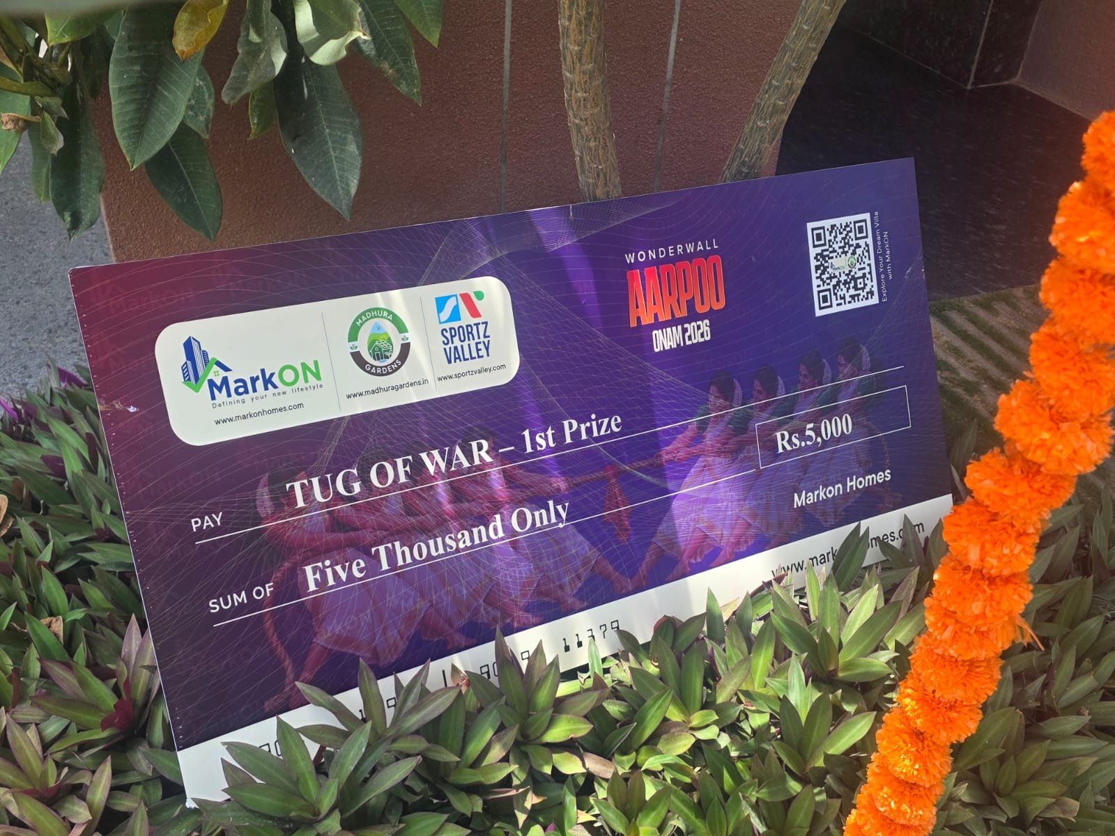 Tug of War 1st Prize cheque of Rs. 5,000, Wonderwall AARPOO Onam 2026